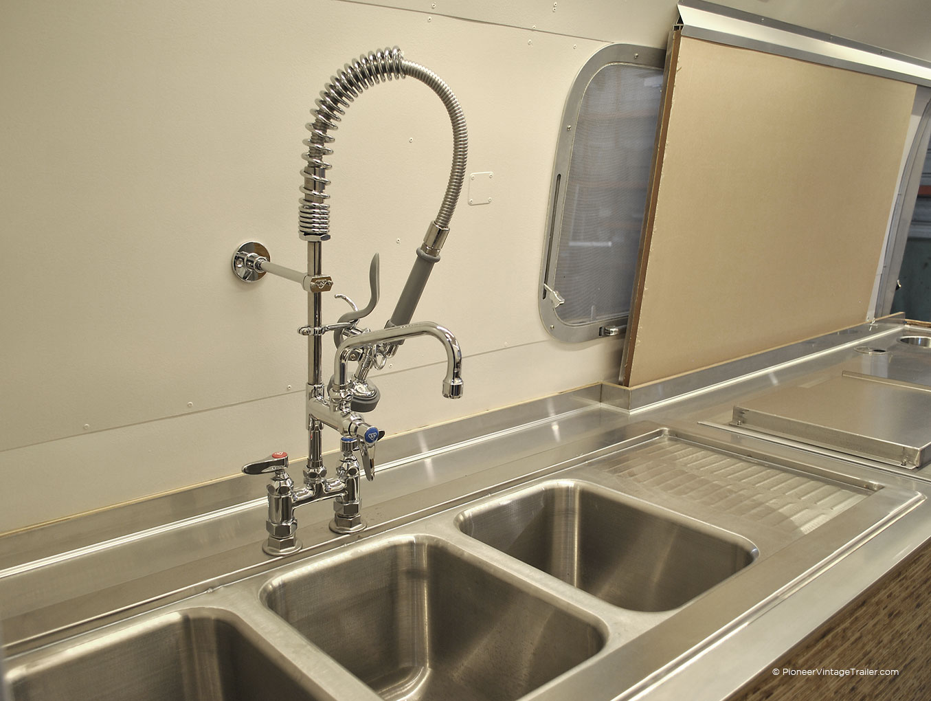 restaurant sink and faucet in Airstream trailer