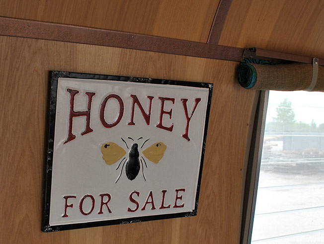 Honey for sale sign in Airstream